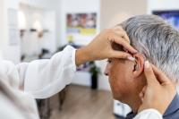 person being fitted with a hearing aid